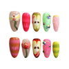 Product display of Naillover’s press-on nail set with green-red gradient, apple motifs, and a whimsical worm