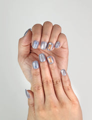 Close-up of Aqua Flash handmade Singapore press on nails in blue, ribbon, and bear pattern