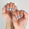 Aqua Flash Singapore press on nails styled with summer outfit, showing glossy bold design