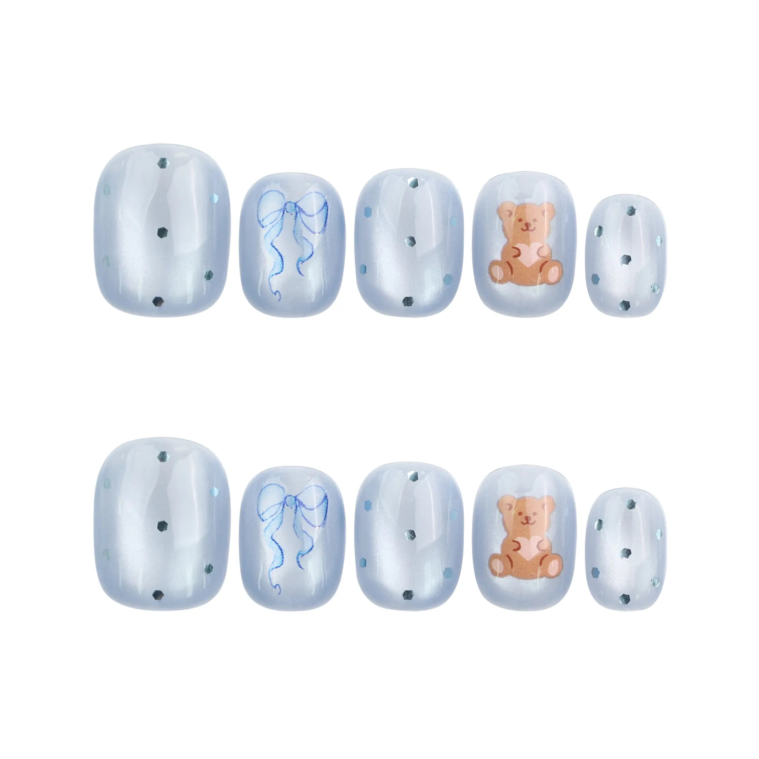 Flat lay of Aqua Flash Singapore press on nails in blue, ribbon, and bear design on white background