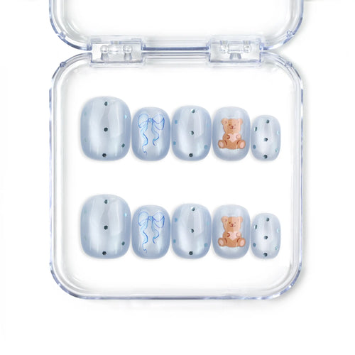 Aqua Flash Singapore press on nails with blue base, ribbon accents, and bear patterns by naillover