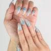 Close-up of Aqua Wave handmade press on nails showing translucent base and delicate details