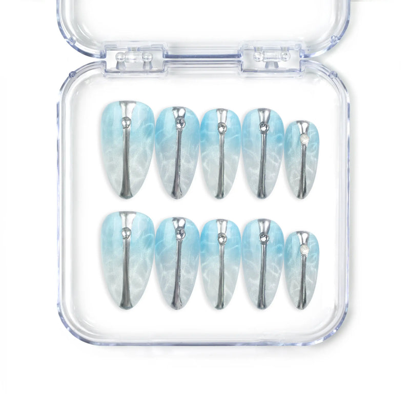 Aqua Wave Singapore press on nails with translucent base, wave patterns, and shimmering details, handmade by naillover for a trendy summer look