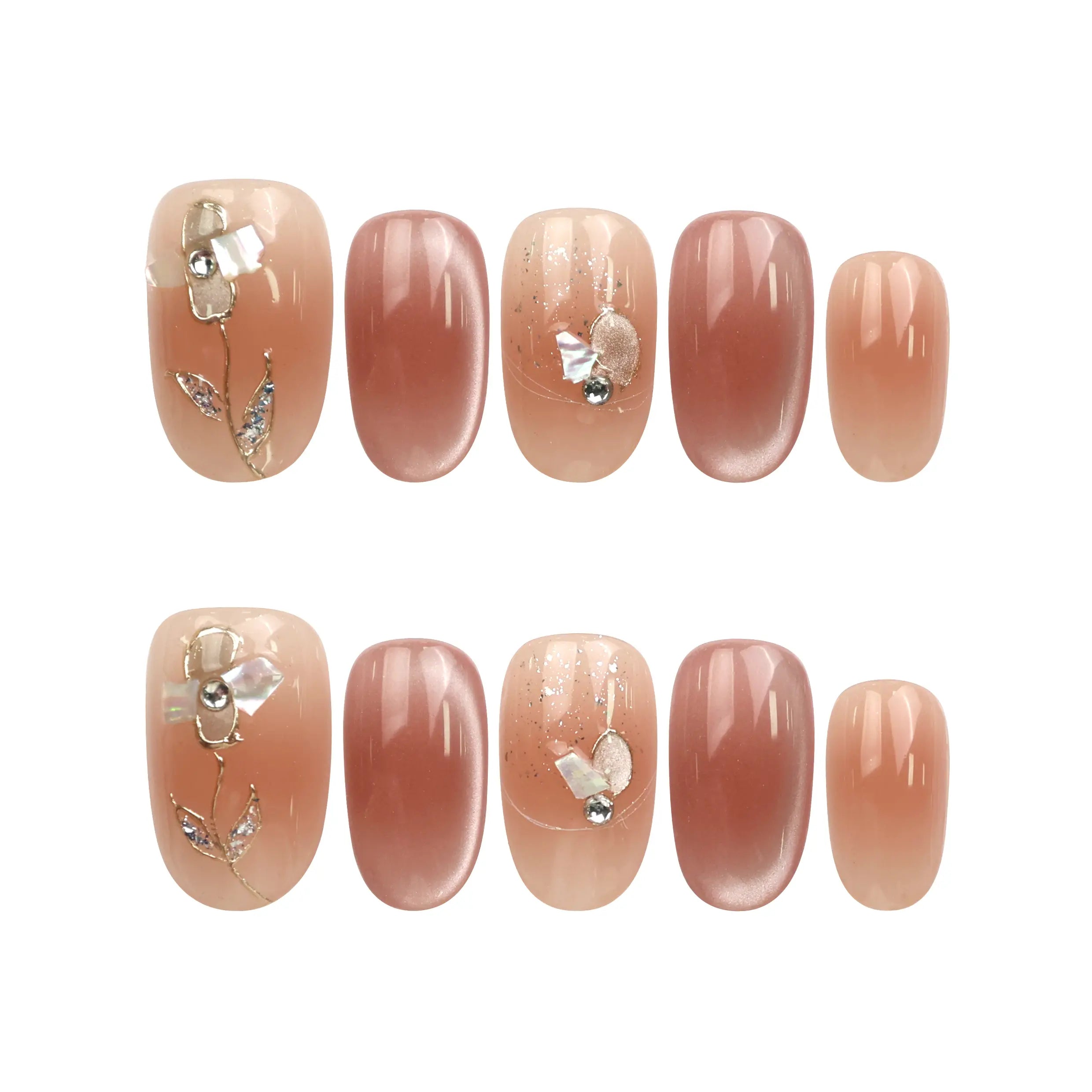 Flat lay of Naillover Autumn Whisper handmade press on nails set featuring nude-to-brown ombre, gold foil, and leaf motif details.