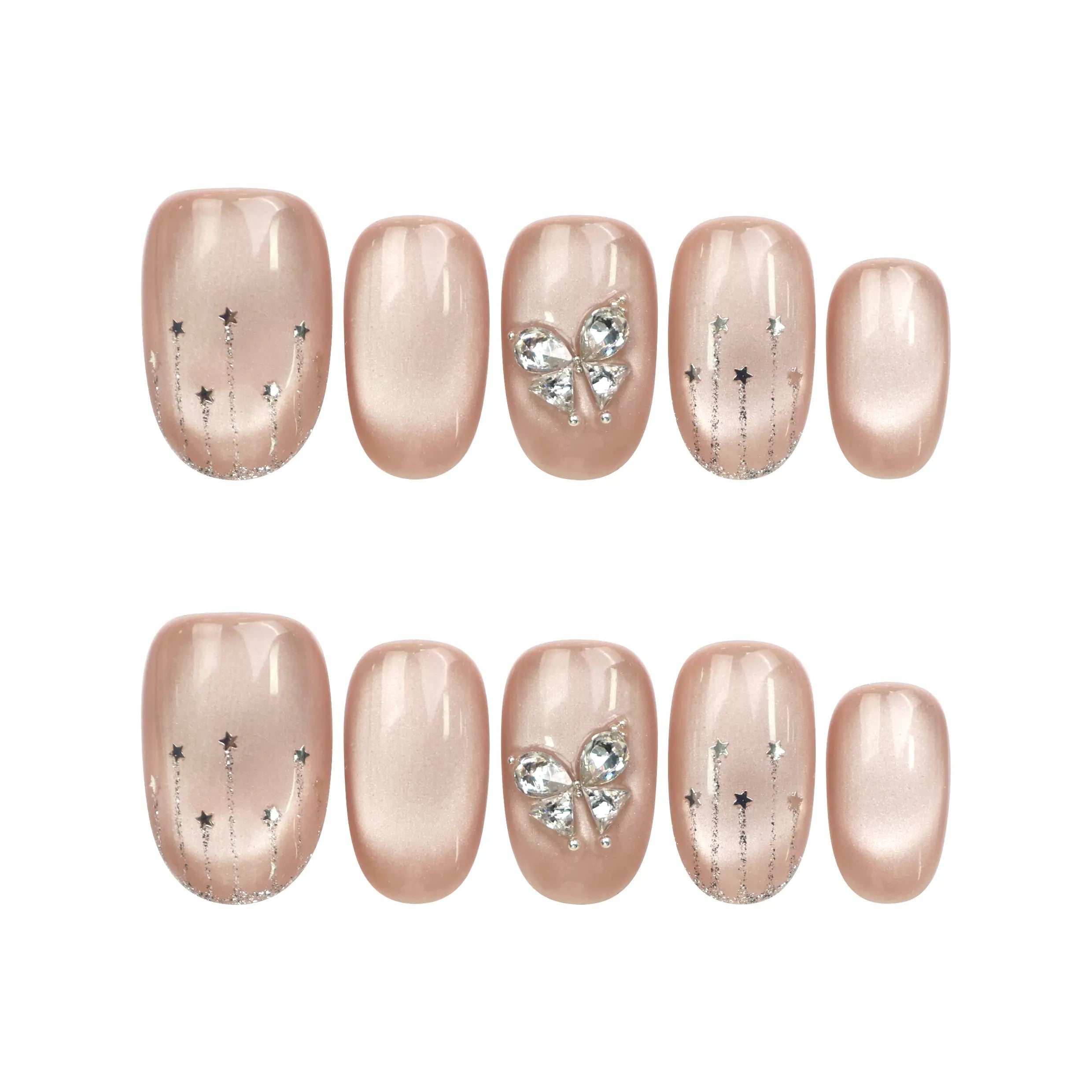 Flat lay of Naillover Beige Elegance Singapore press on nails set, featuring handmade cat eye shimmer nails with butterfly charms and glitter accents.