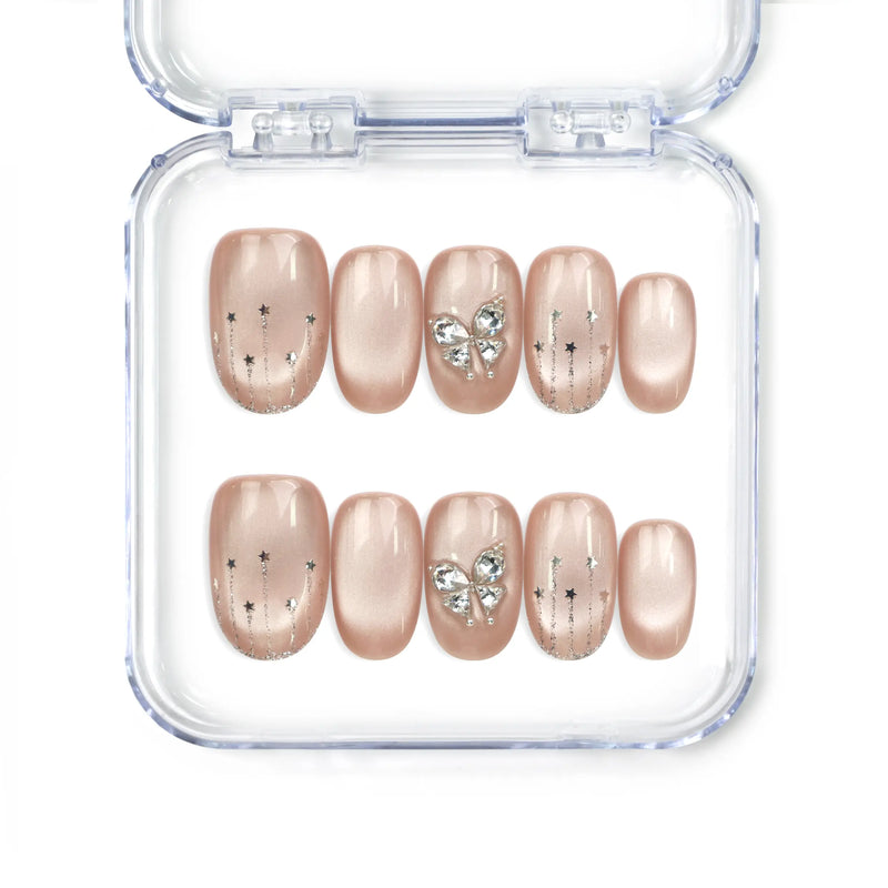 Naillover Beige Elegance handmade press on nails with cat eye shimmer, silver butterfly charms, and glitter stripes from Singapore press on nails collection.