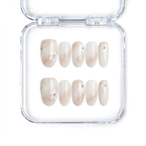 Singapore handmade press on nails with sheer base and delicate white and pink floral nail art by Naillover