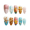 Product display of Naillover’s handmade Singapore nail set with summery pink, seashell texture, and marine elements