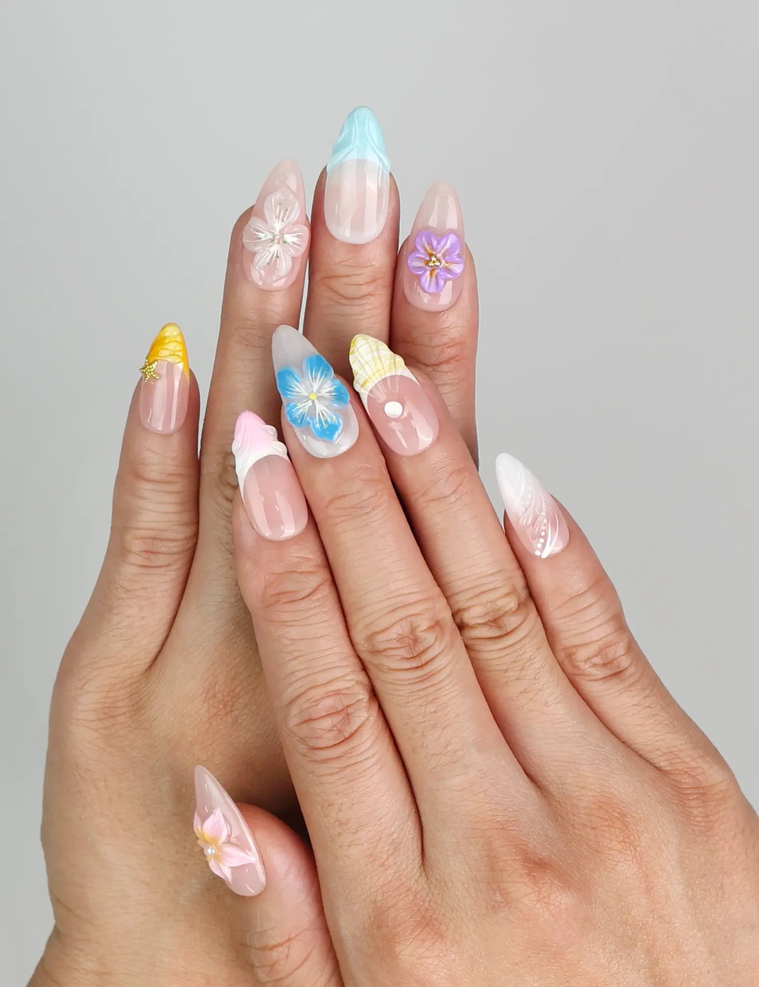 Model wearing Blossom Gradient 3D summer nails Singapore with pastel gradient colors
