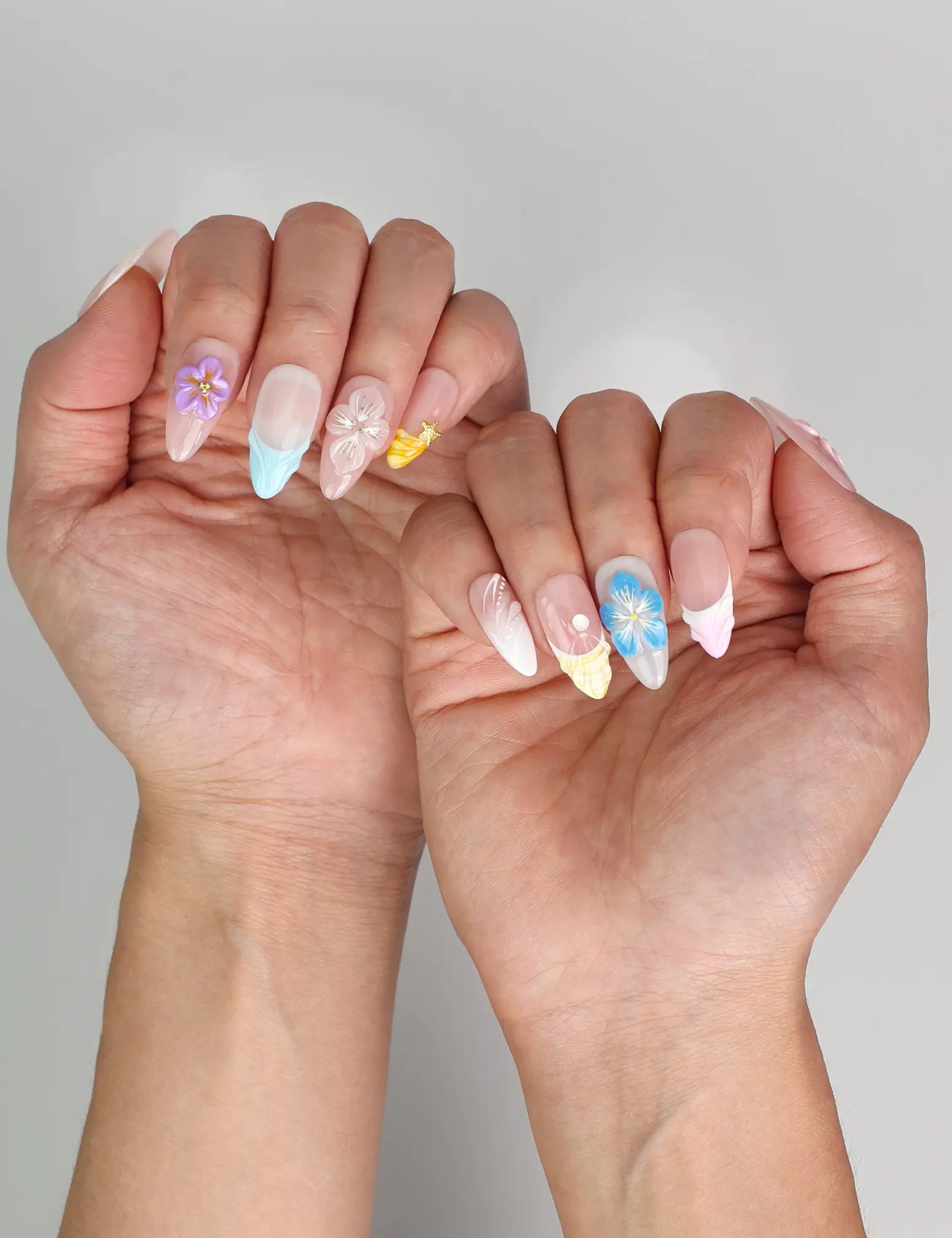 Elegant summer nails in pastel gradient from naillover, worn outdoors in natural light