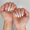 Elegant summer nails in pastel gradient from naillover, worn outdoors in natural light