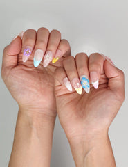 Elegant summer nails in pastel gradient from naillover, worn outdoors in natural light