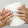 Naillover Blossom Gradient press on nails Singapore with 3D flowers while holding a cup