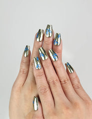 Hand wearing Blue Aura Singapore press on nails by naillover, showing golden sheen and blue butterflies in a trendy summer design.