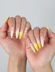 Bold and futuristic stiletto nails featuring high-shine galaxy tones and sculpted metallic swirl accents
