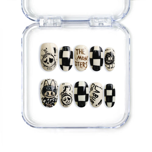 Short oval handmade press-on nails with cartoon prints and glossy finish from Naillover’s Singapore collection.