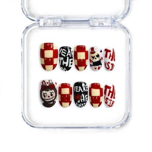 Short oval press-on nails with doodle art, checkerboards, and red accents from Naillover’s handmade Singapore nail collection.