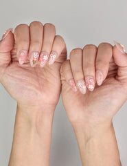 Naillover Bunny Blush trendy nails styled on hand, featuring pink handmade press on nails with whimsical animal and floral accents.