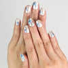 Hand wearing Butterfly Light short press-on nails with chrome base and blue butterflies from Naillover Singapore.