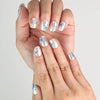 Close-up of Butterfly Light short press-on nails featuring vivid blue butterfly accents, handmade in Singapore by Naillover.