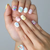 Close-up of Naillover’s handmade short nails featuring cute candy-themed designs and glossy pastel finish
