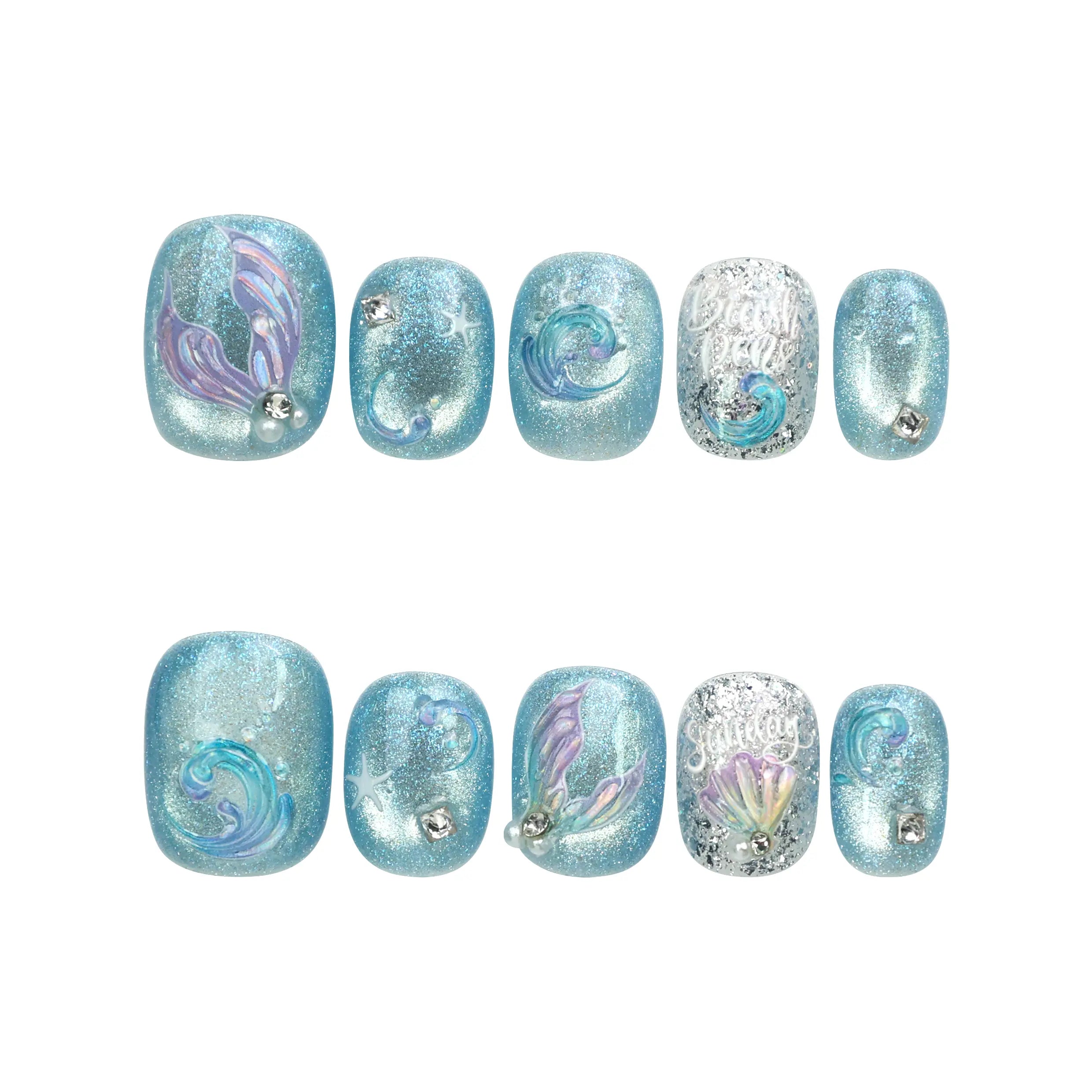 Flat lay of Naillover Celestial Blue handmade press on nails set featuring bold swirling designs and shimmering accents.