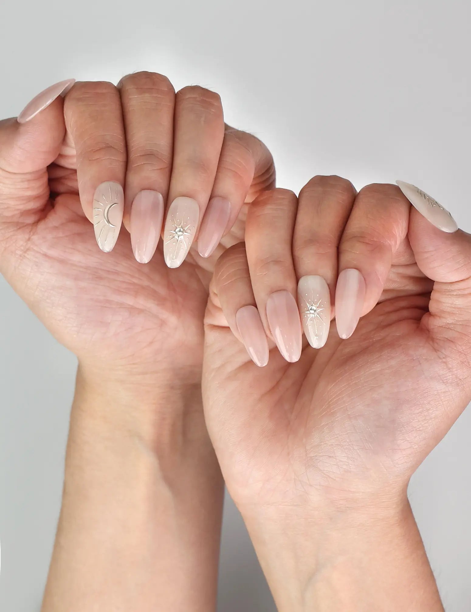 Naillover Celestial Pink trendy nails shown on model’s hand with soft pastel design