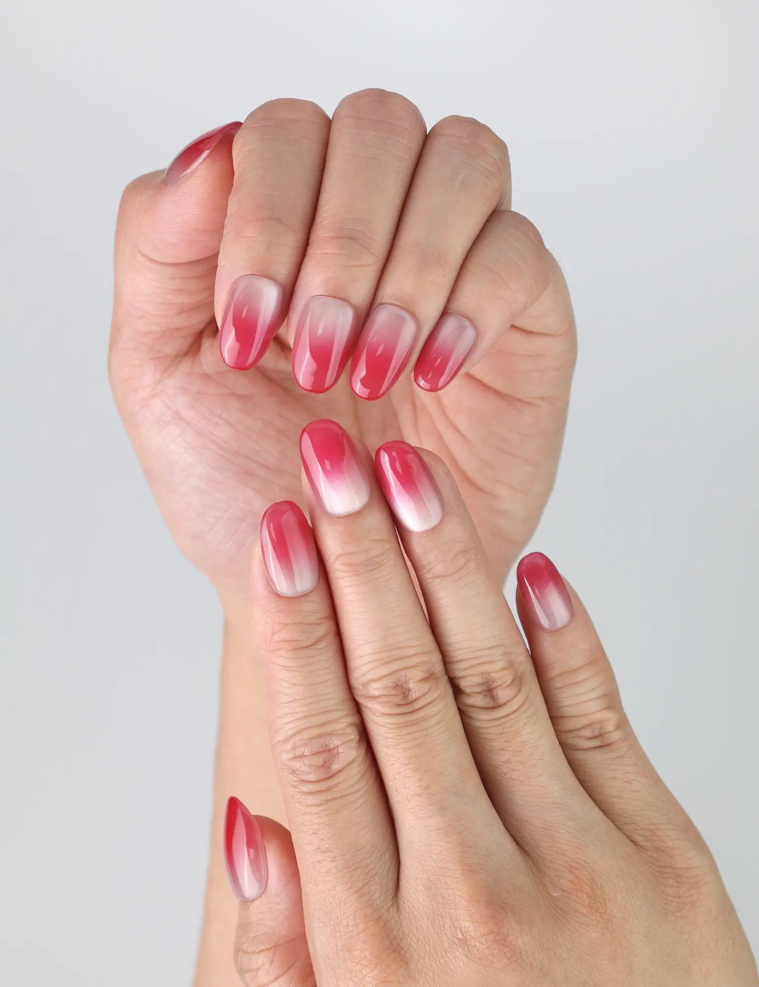 Close-up of Naillover’s short handmade pink nails with oval shape, featuring subtle shimmer and ombré fade
