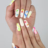 Singapore handmade press on nails in a cute coffin shape, featuring colorful line art, stars, and playful artistic details