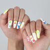 Medium length coffin nails with bold neon colors, quirky squiggles, and abstract charm for a fun statement look