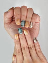 Close-up of Cozy Plaid Glaze plaid short coffin press on nails in brown chrome, Naillover Singapore collection