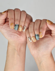Naillover handmade Cozy Plaid Glaze short coffin nails in plaid and cat-eye shimmer shown on model hand