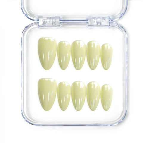 Naillover Singapore handmade short almond nails in glossy pastel yellow for a cheerful, soft look
