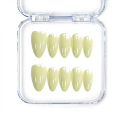Naillover Singapore handmade short almond nails in glossy pastel yellow for a cheerful, soft look