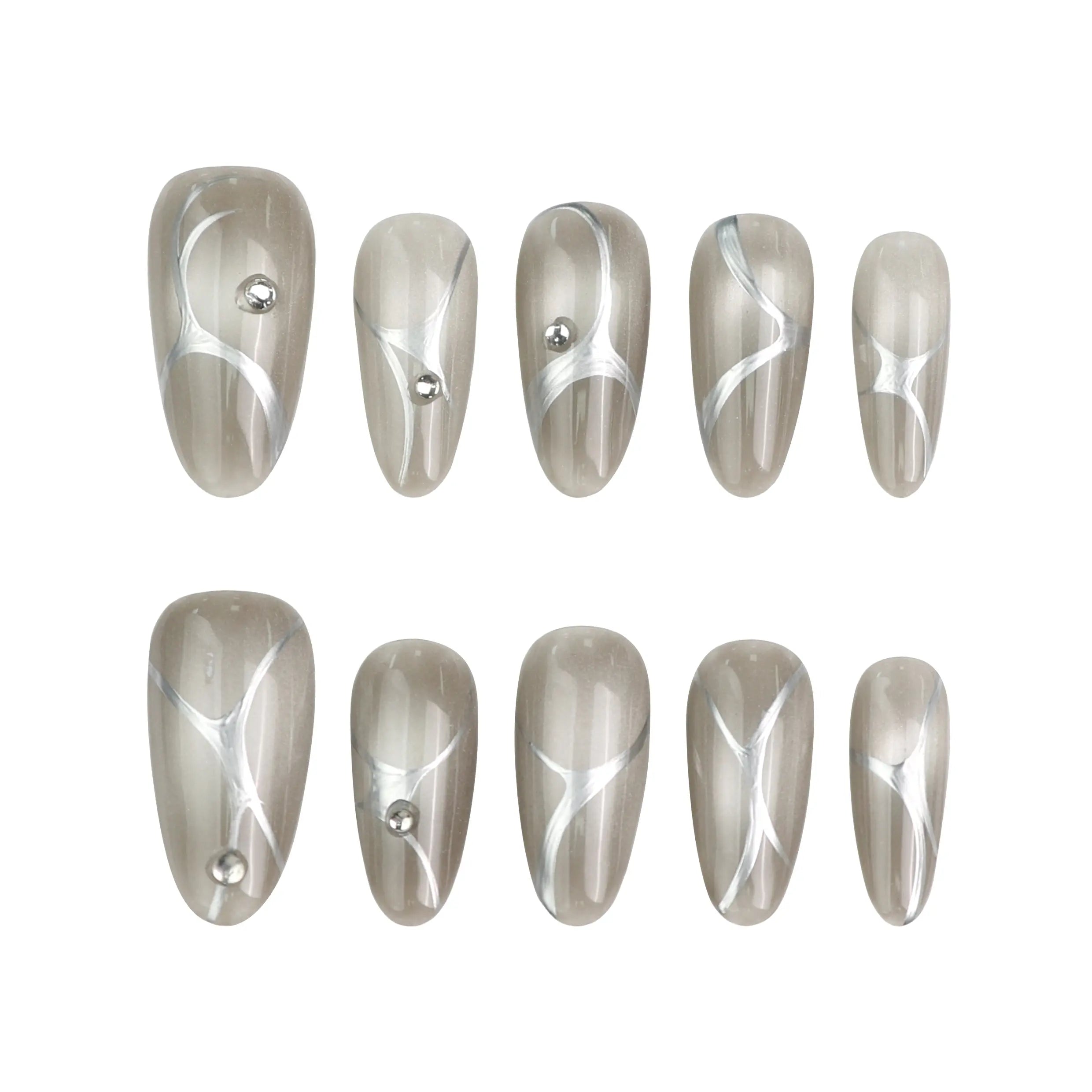 Product display of Singapore handmade silver press on nails with glossy chrome finish and crystal details by Naillover