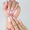 Close-up of Naillover’s handmade pink marble coffin nails featuring shimmering silver gem charms and soft gradient blend