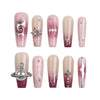 Product display of Naillover handmade pink marble coffin press-on nails with nude gradient and silver charm embellishments