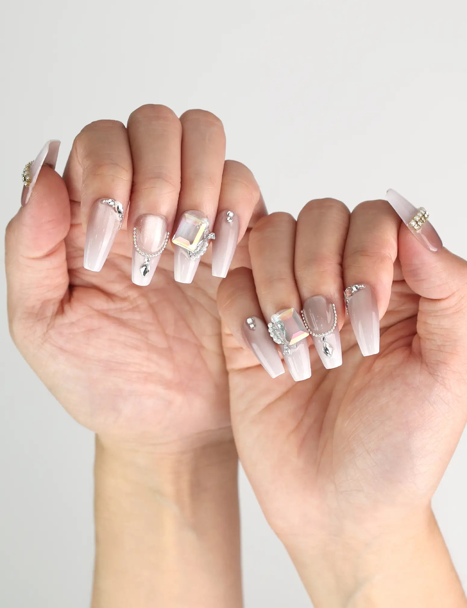 Elegant look featuring Dolce Peach glossy pink coffin press on nails with silver chain accents by naillover