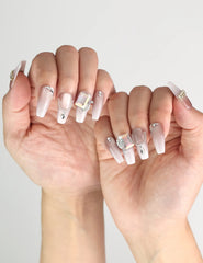 Elegant look featuring Dolce Peach glossy pink coffin press on nails with silver chain accents by naillover