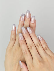Model wearing Eclipse Stars Singapore press on nails with pastel gradient and star design, handmade by naillover