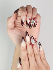 Close-up of Eternal classic burgundy press-on nails with silver details, handmade Singapore nails by naillover