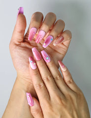 Close-up of Naillover’s handmade ombré press-ons with shimmering iridescent rhinestones and glossy finish