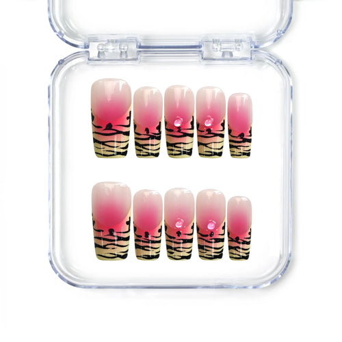 Handmade pink press on nails from Singapore with zebra print and ombré base by Naillover