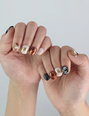 Floral Glow handmade press on nails by Naillover worn on hand, highlighting brown-black contrast and soft shimmer pearls.