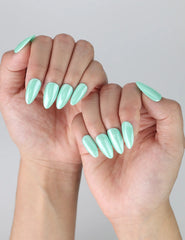Side view of short almond pastel green nails, ideal for a minimal and refreshing spring manicure