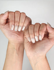Stylish Singapore press on nails look featuring NailLover Frosted Glare shimmering silver cat eye nails