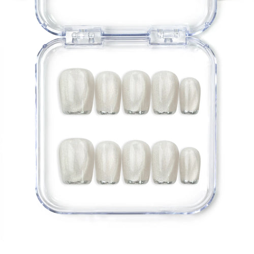 Close-up of NailLover Frosted Glare handmade press on nails in silver shimmer with cat eye effect on white background