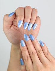 Close-up of Frosted Skyline handmade almond nails, glowing with cool-toned shimmer by Naillover.