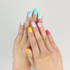 Model wearing Fruit Punch handmade Singapore press on nails in bright fruity colors – close-up view