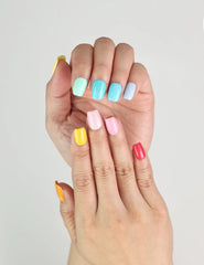 Hand with Fruit Punch Singapore press on nails by Naillover, glossy finish in vibrant fruit-inspired shades